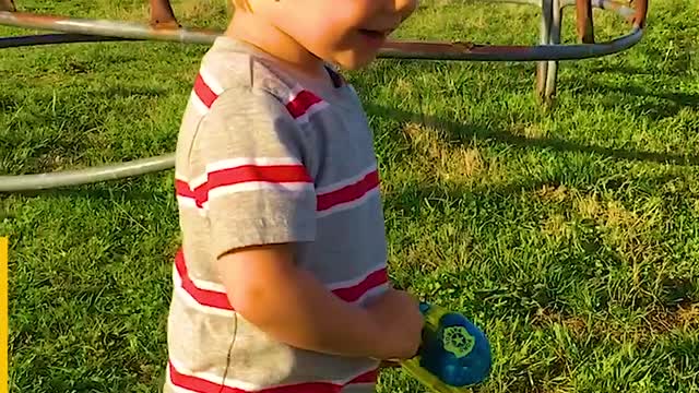 Little Boy Catches Fish With Toy Rod