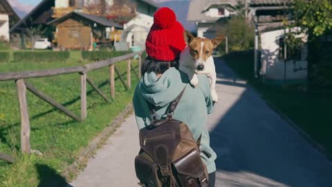 Happy owner and her doggy spend time together