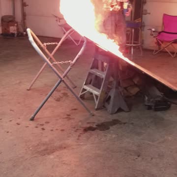 Man Rides Dirt Bike Over Flaming Ramp