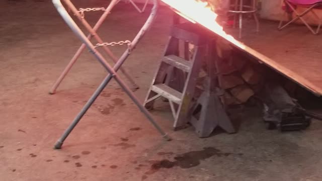 Man Rides Dirt Bike Over Flaming Ramp