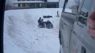 Sledding behind the truck