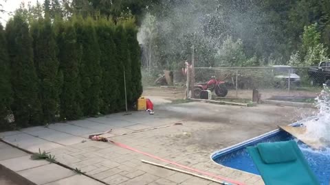 Snowmobile Skips Over a Swimming Pool