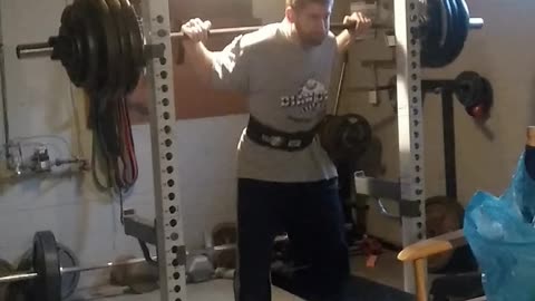 390 pound squat grind belted