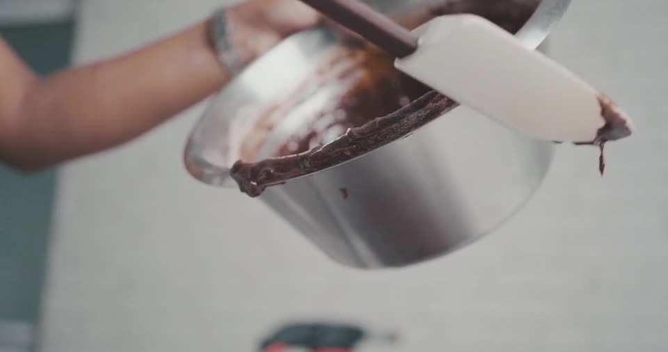 Putting A Chocolate Mixture On A Baking Tray
