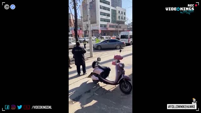 Chinese surveillance workers destroy a car...