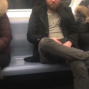 Sleeping man on subway train wakes up from baby crying