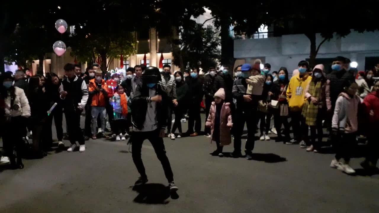 Young boy dancing on street to welcome new year 2021