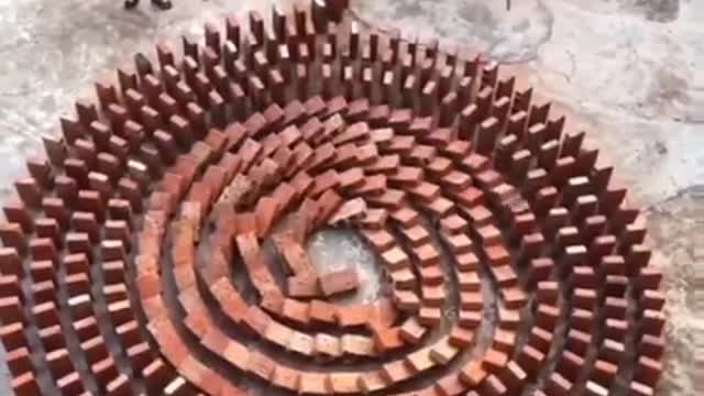 These videos of rows of dominoes falling are always mesmerizing.
