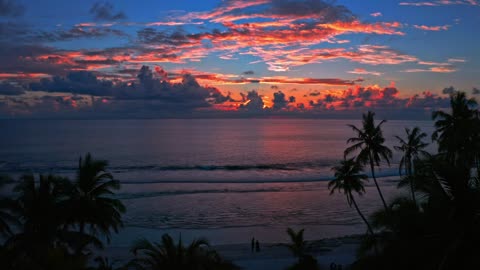 The beach at sunset in the background