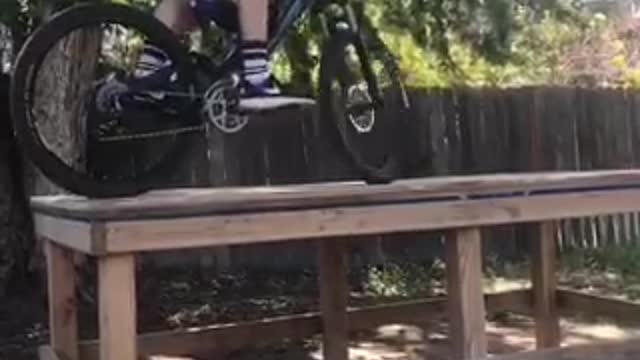 Bike face plant from wooden plank