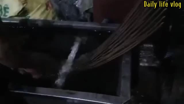 Skilled workers are pulling plastic pellets at the tractor