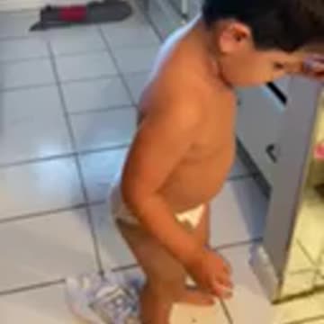 Elijah cleans his spilled water. April 2022