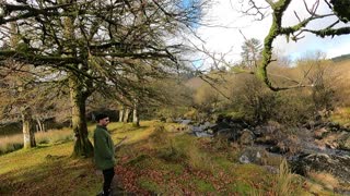 Standing by the river footage.