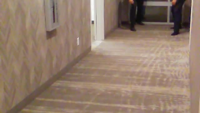 Guy black shirt running in hallway and falling