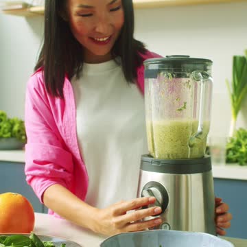 Woman Blending Fruits and Vegetables