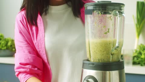 Woman Blending Fruits and Vegetables