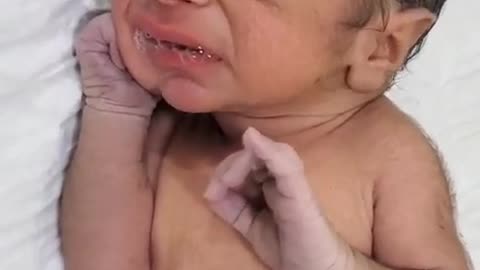 Water coming out from baby's mouth... that's good for baby