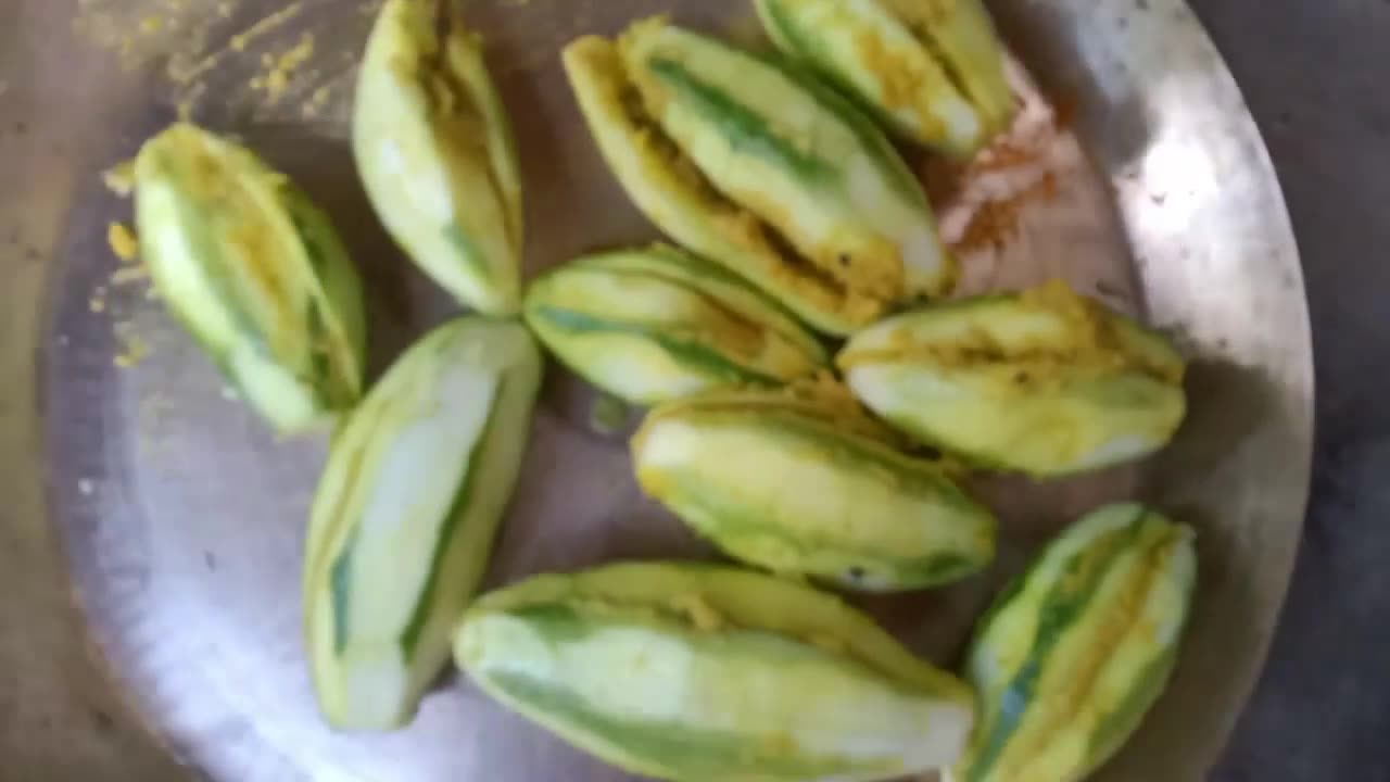 Pointed gourd/Potol chop cooking in the village clay oven