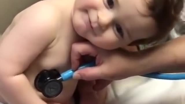 Sweet baby boy rests on nurse’s hand