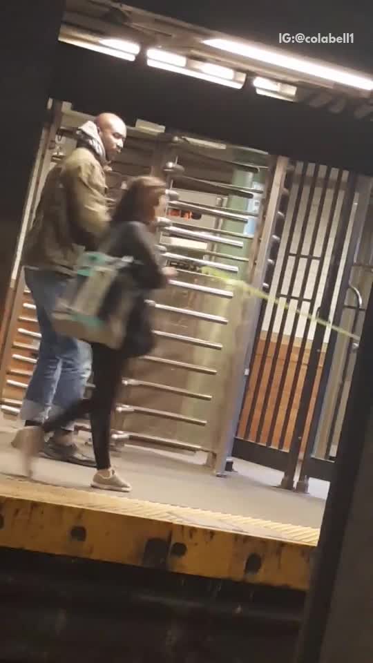 Man with green jacket exercise belt station