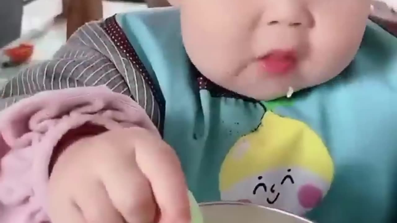 Cute baby eiting food