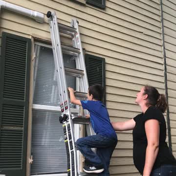 Boy climbs into window after locking door