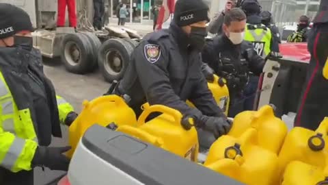 Ottawa Police confiscating fuel and containers from the convoy for freedom truckers,