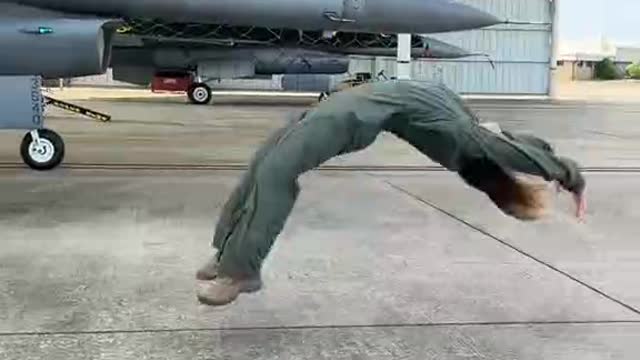 Beauty backflips against fighter jets