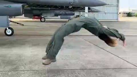 Beauty backflips against fighter jets