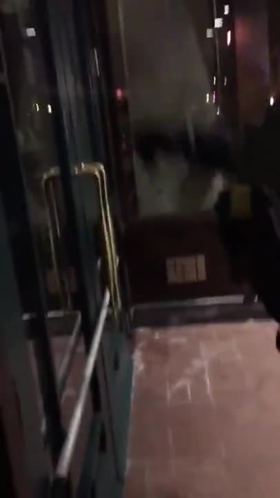 Police place a bar across door to hotel of Trumpers