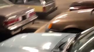 Guy Walks into Parking Garage Full of Retro Vehicles