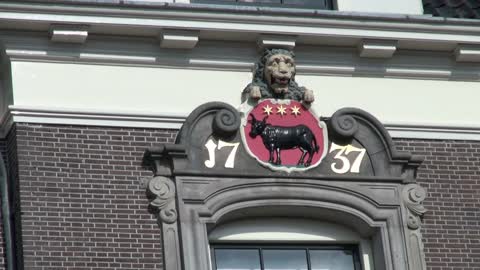 Netherlands Edam lion gargoyle and cow emblem