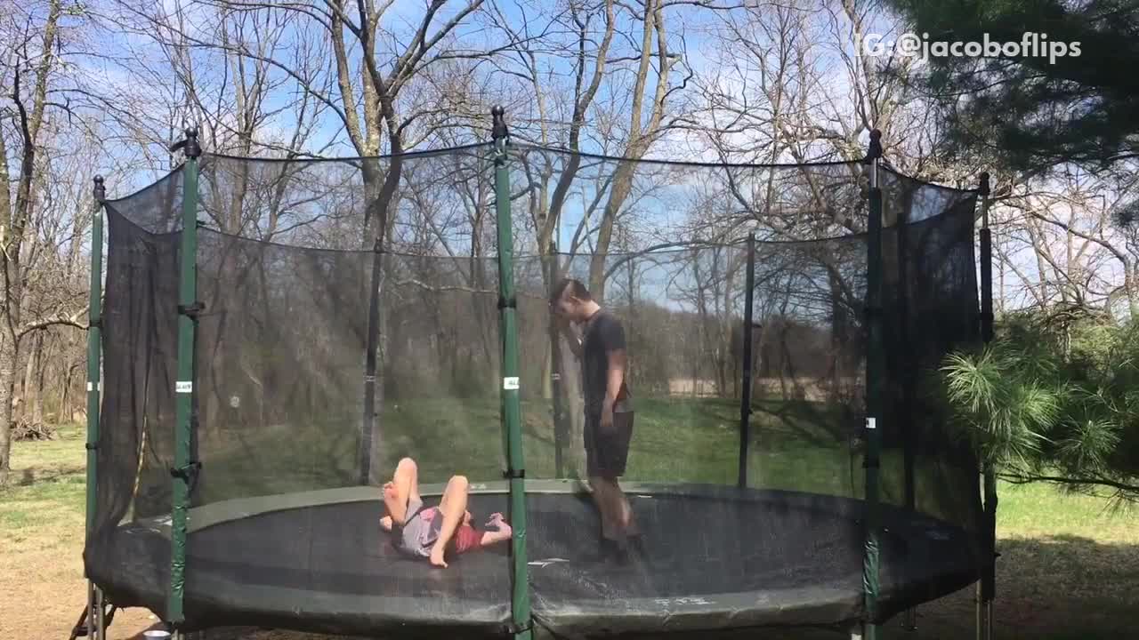 Guy in red shirt back flip on neck