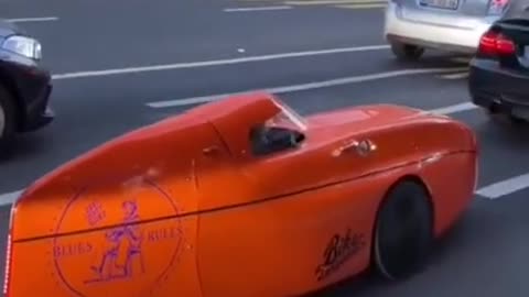 Meet the smallest bullet car ever made stuck in traffic.