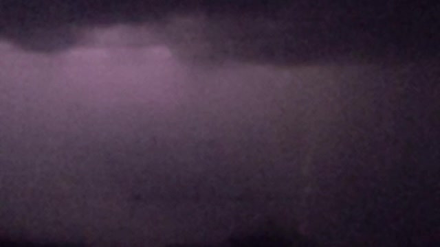 Object Falls from Sky During Slow Motion Lightning Strike