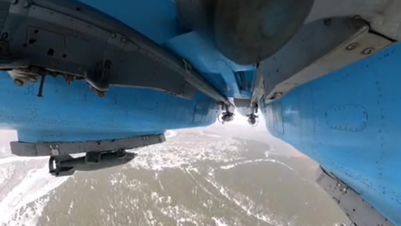 A Sukhoi Su-34 fighter-bomber drops P-50T training bombs at the range.