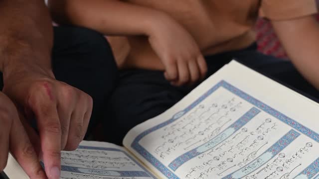 a-man-teaching-his-son-to-read