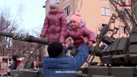 Residents greet the fighters on the streets.