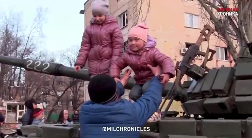 Residents greet the fighters on the streets.