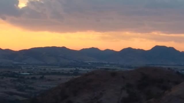 Aerial view of an arid landscape during sunset