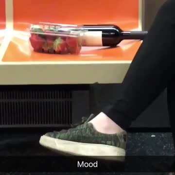 Mood person has strawberries and wine on subway