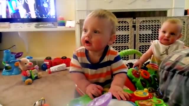 Adorable twins watch how happy they are