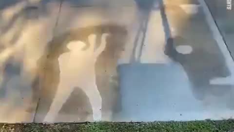 A man drawn with water on the asphalt