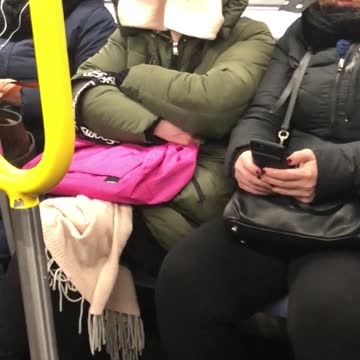 Girl green jacket fur face covered with white cloth