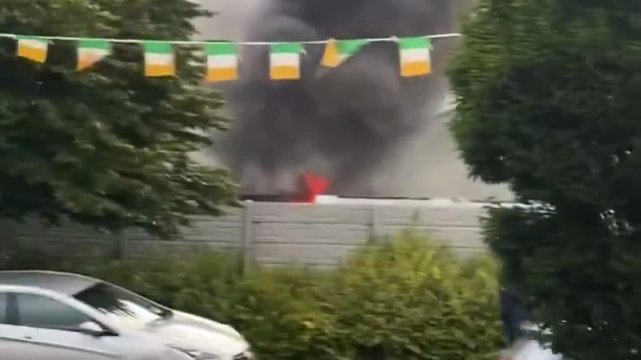 Flames can be seen rising from behind the wall at Coolock crown paints.