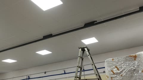 Asbestos sheet covered with T-Grid ceiling