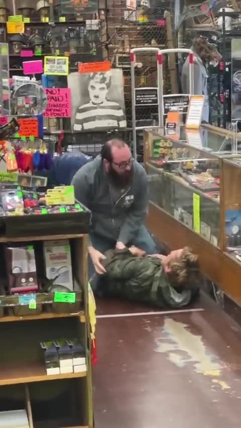 Portland clothing store Andy & Bax employees tase & handcuff thief.