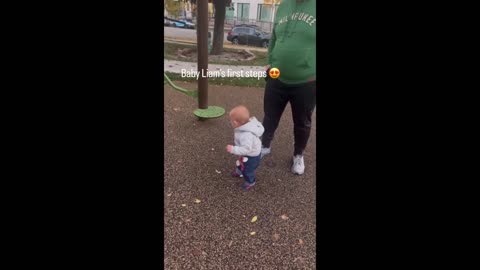 Baby's first steps are accidentally photographed by the mother.