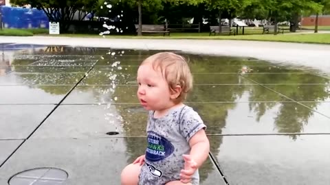 Cute Babies Enjoying With Water