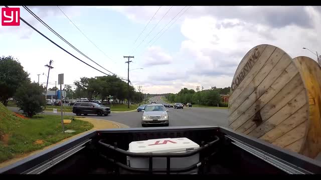 Truck Looses Spool and It Rolls Into Traffic